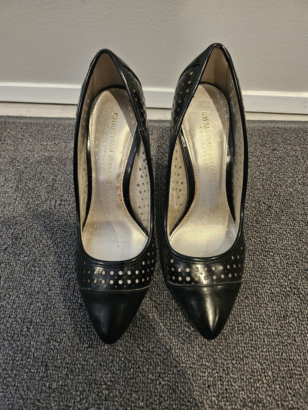Black pointed-toe perforated pumps size 5W by Christian Siriano for Payless.